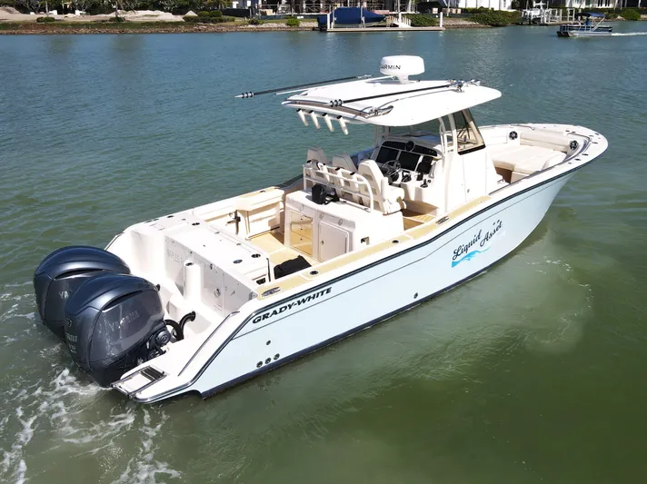 Liquid Asset Yacht Photos Pics 2022 Grady-White 326 CANYON boat with twin engines on calm water.