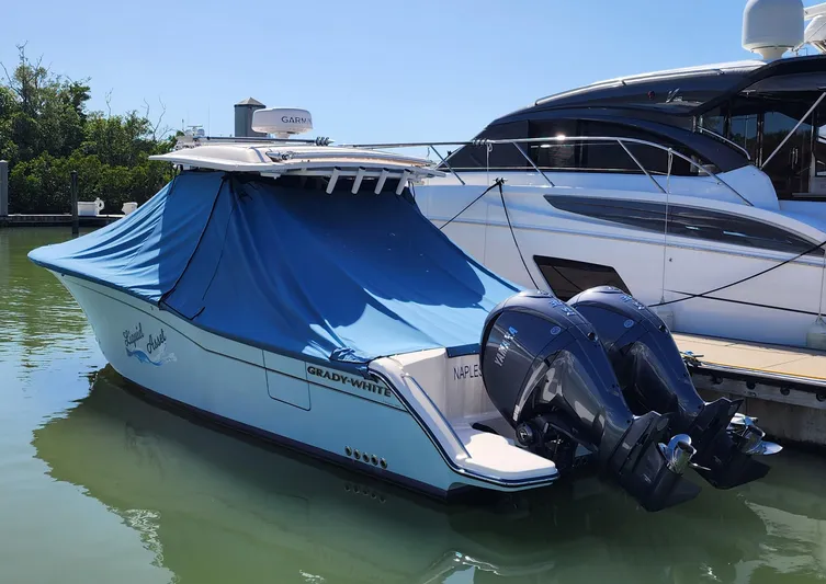 Liquid Asset Yacht Photos Pics 2022 Grady-White 326 CANYON boat docked with blue cover and twin outboard motors.