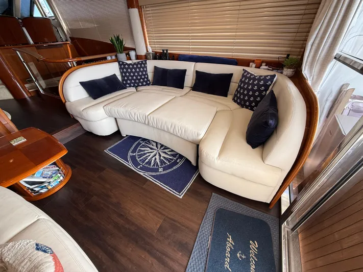 Just Chillin Yacht Photos Pics Luxurious interior of 2006 Viking Princess 61 Flybridge yacht with elegant seating and decor.