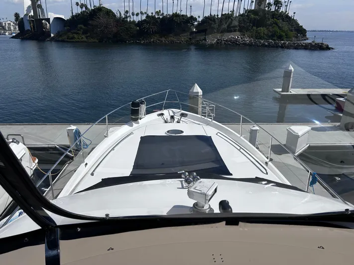 Just Chillin Yacht Photos Pics Viking Princess 61 Flybridge yacht docked at marina, 2006 model, scenic water view.