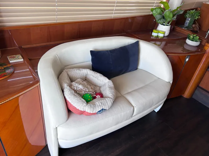 Just Chillin Yacht Photos Pics Luxurious interior of 2006 Viking Princess 61 Flybridge with cozy seating and decor.