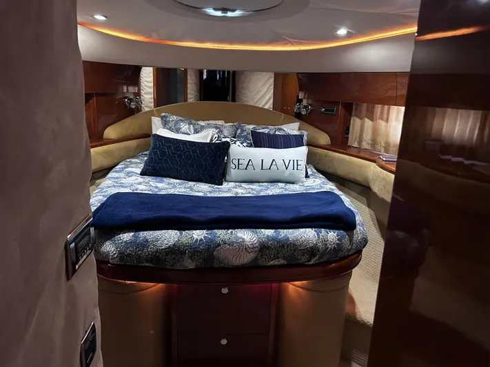 Just Chillin Yacht Photos Pics Luxurious bedroom interior of 2006 Viking Princess 61 Flybridge yacht with elegant bedding.