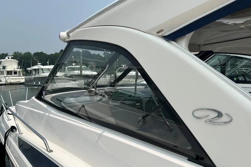 Sound Decision Yacht Photos Pics 2013 Regal 35 Sport Coupe yacht docked at marina, side view.