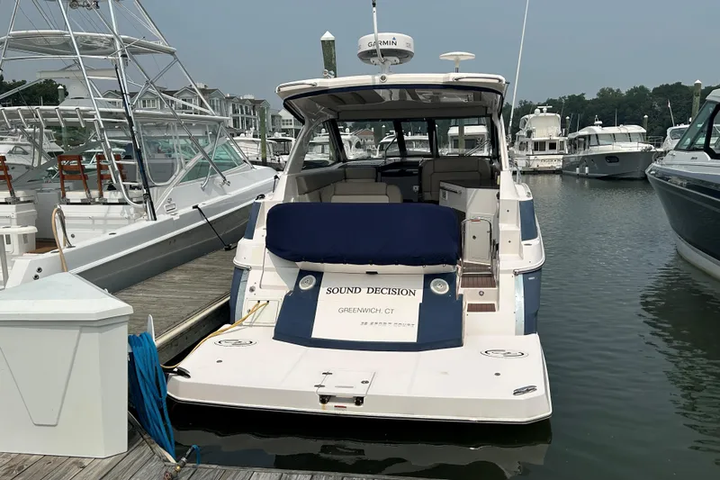 Sound Decision Yacht Photos Pics 2013 Regal 35 Sport Coupe docked at marina, rear view.