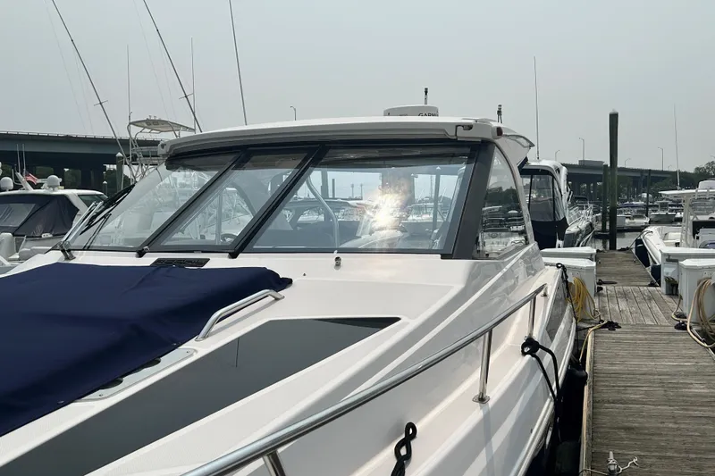 Sound Decision Yacht Photos Pics 2013 Regal 35 Sport Coupe docked at marina, showcasing sleek design and modern features.