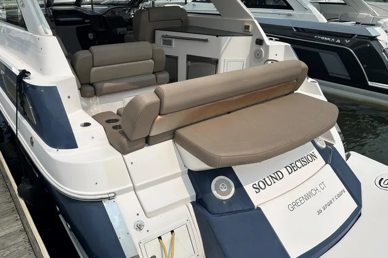 Sound Decision Yacht Photos Pics 2013 Regal 35 Sport Coupe yacht with beige seating, docked in Greenwich, CT.