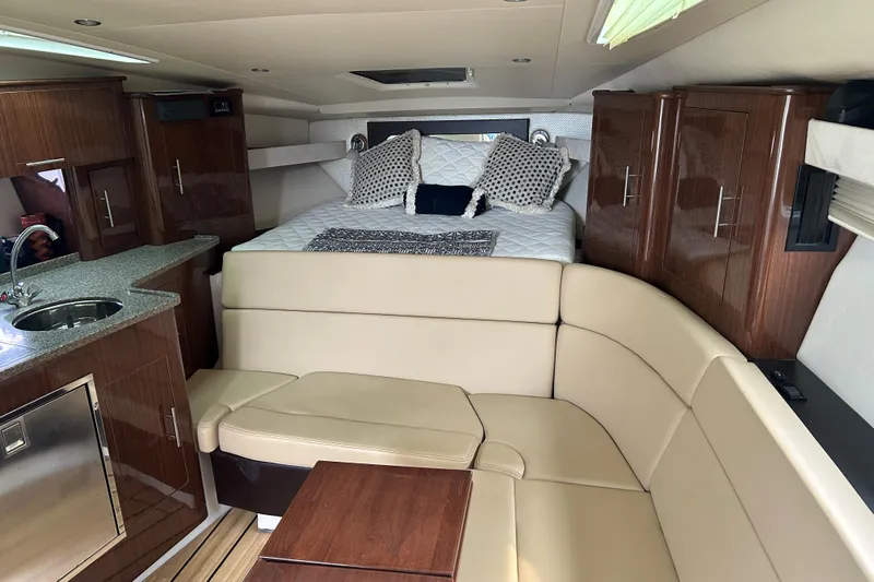 Sound Decision Yacht Photos Pics Interior of 2013 Regal 35 Sport Coupe with cozy seating and modern amenities.