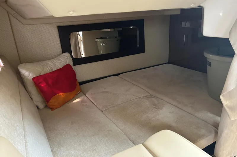 Sound Decision Yacht Photos Pics Interior cabin of 2013 Regal 35 Sport Coupe with cozy seating and colorful pillows.