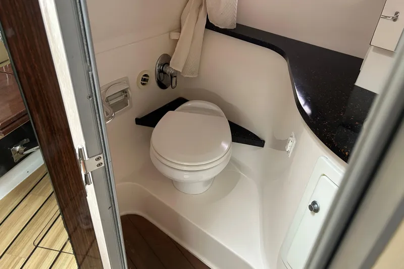 Sound Decision Yacht Photos Pics 2013 Regal 35 Sport Coupe bathroom with modern toilet and sleek countertop design.