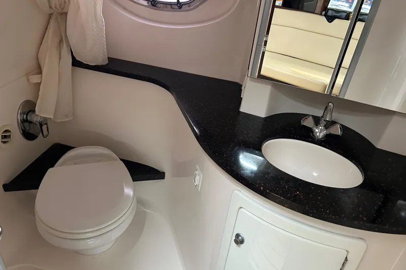 Sound Decision Yacht Photos Pics Bathroom interior of 2013 Regal 35 Sport Coupe with sink and toilet.