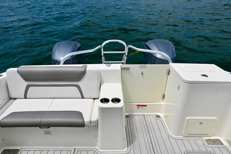  Yacht Photos Pics 2018 World Cat 320 DC boat deck with seating and twin engines on water.