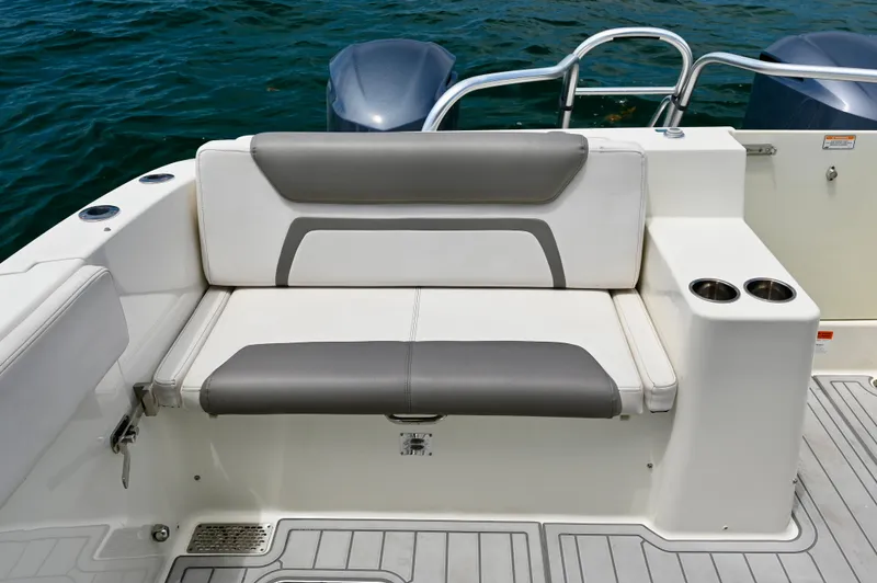  Yacht Photos Pics 2018 World Cat 320 DC boat seating with cup holders, on water.