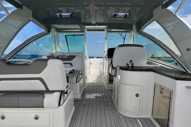  Yacht Photos Pics Interior of 2018 World Cat 320 DC boat with luxurious seating and ocean view.