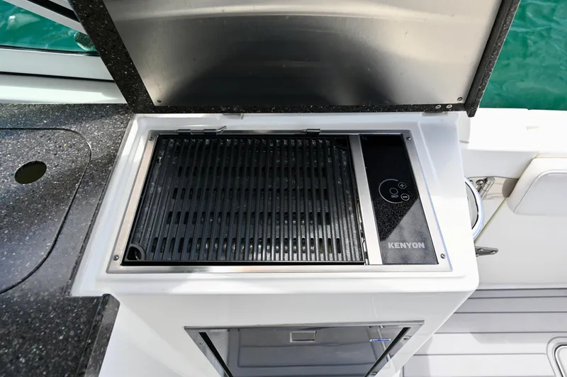  Yacht Photos Pics Outdoor grill on 2018 World Cat 320 DC boat, featuring Kenyon electric cooktop.