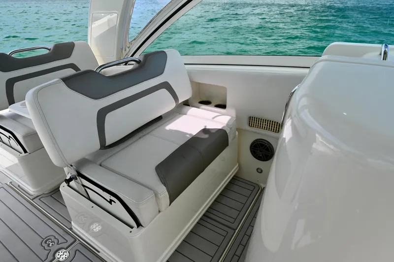  Yacht Photos Pics 2018 World Cat 320 DC boat interior with cushioned seating and ocean view.