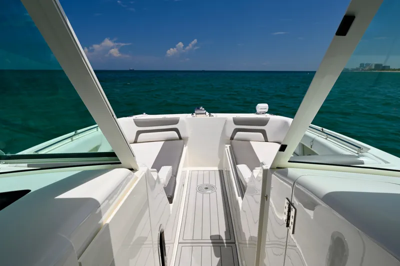 Yacht Photos Pics 2018 World Cat 320 DC boat interior with ocean view, featuring sleek seating and open deck.