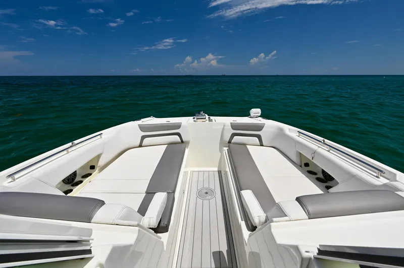  Yacht Photos Pics 2018 World Cat 320 DC boat interior with ocean view, featuring spacious seating and clear skies.