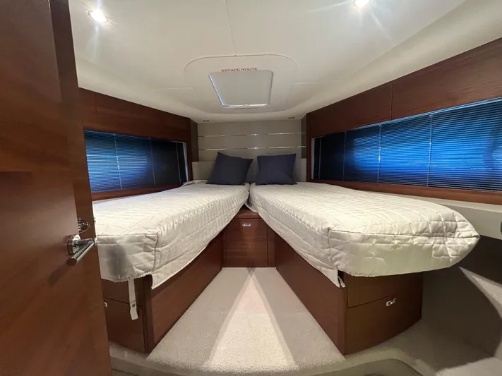  Yacht Photos Pics Luxurious twin cabin interior of 2020 Princess V50 yacht with modern design.