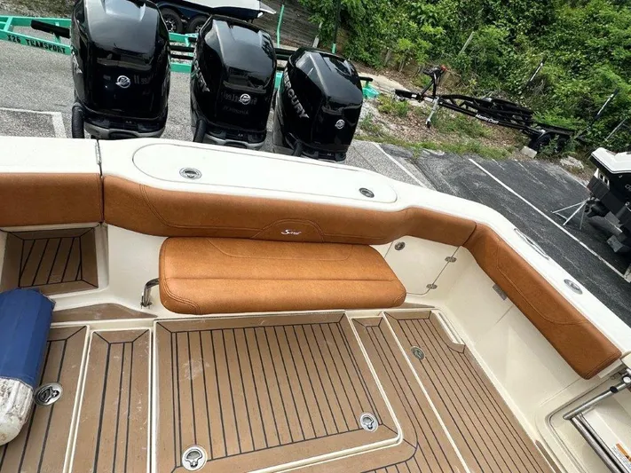 Yacht Photos Pics 2018 Scout 350 LXF boat interior with tan seating and multiple outboard engines.