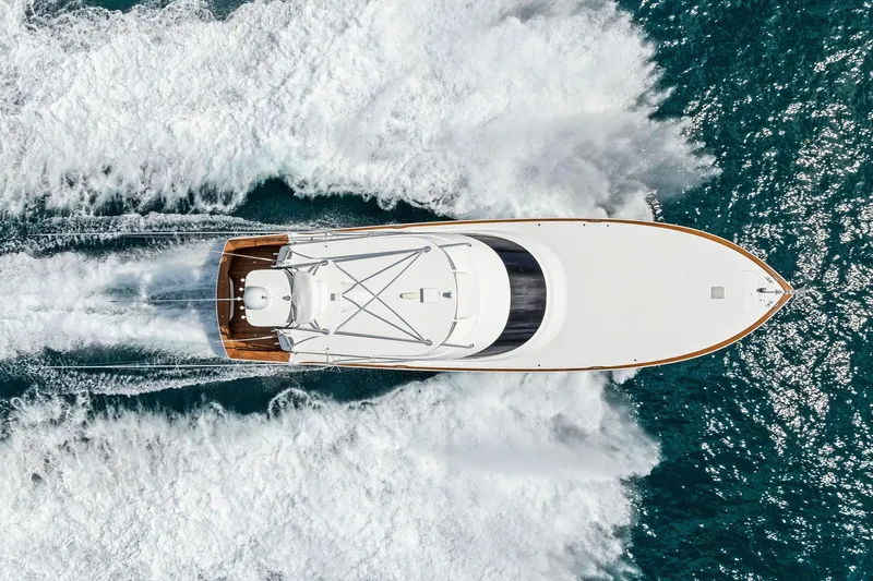  Yacht Photos Pics Overhead view of 2018 Viking 80 Convertible yacht cruising through ocean waves.