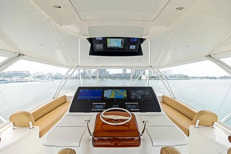  Yacht Photos Pics Luxurious helm of 2018 Viking 80 Convertible yacht with advanced navigation systems.