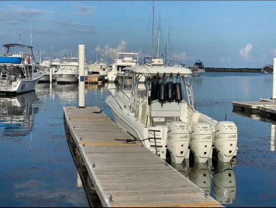  Yacht Photos Pics 2006 Hydra-Sports 33 Vx boat docked at a marina with multiple outboard engines.