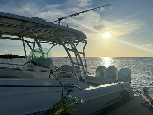  Yacht Photos Pics 2006 Hydra-Sports 33 Vx boat docked at sunset on the water.
