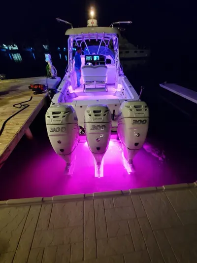  Yacht Photos Pics 2006 Hydra-Sports 33 Vx boat with illuminated engines at night.