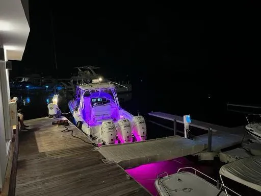  Yacht Photos Pics 2006 Hydra-Sports 33 Vx boat docked at night with purple lights.