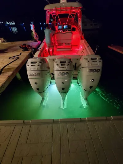  Yacht Photos Pics 2006 Hydra-Sports 33 Vx boat with triple 300 horsepower engines, docked at night.