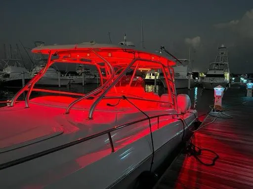  Yacht Photos Pics 2006 Hydra-Sports 33 Vx boat with red LED lights docked at night.