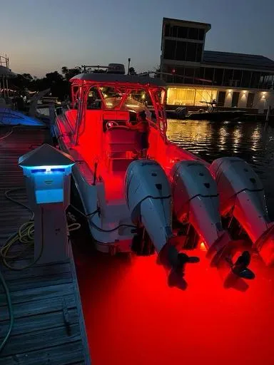  Yacht Photos Pics 2006 Hydra-Sports 33 Vx boat with red interior lights docked at night.