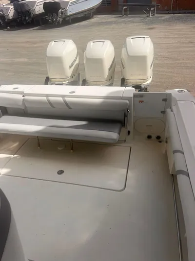  Yacht Photos Pics 2006 Hydra-Sports 33 Vx boat with triple outboard engines, rear seating, and spacious deck.