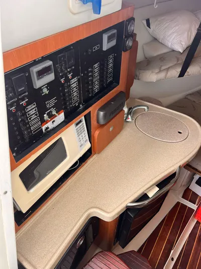  Yacht Photos Pics 2006 Hydra-Sports 33 Vx cabin interior with control panel and kitchenette.