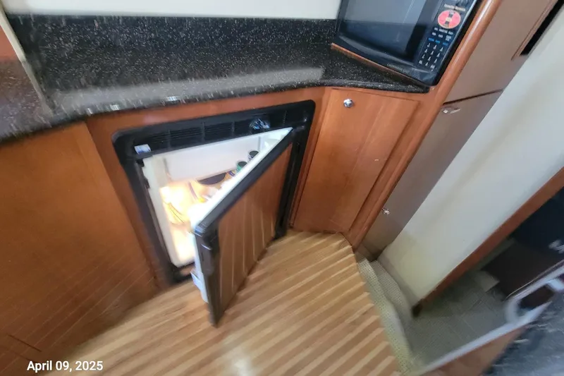 'perrydise' Yacht Photos Pics 2007 Meridian 341 Sedan interior with open fridge and microwave in Galley