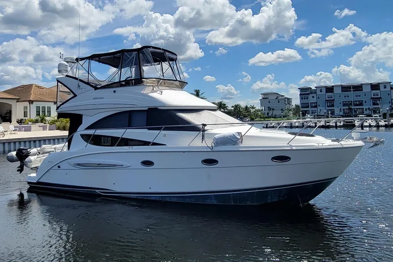 'perrydise' Yacht Photos Pics 2007 Meridian 341 Sedan yacht docked under a bright blue sky.