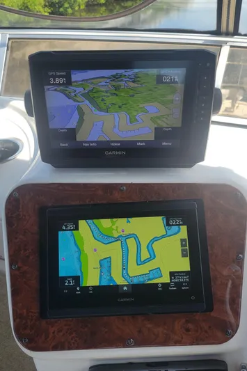'perrydise' Yacht Photos Pics Garmin navigation screens on a 2007 Meridian 341 Sedan boat dashboard.