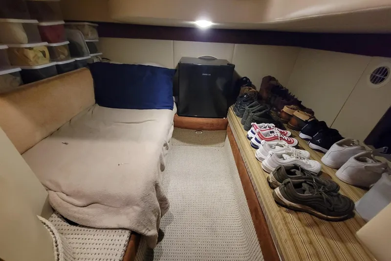 'perrydise' Yacht Photos Pics Cozy 2nd cabin interior of 2007 Meridian 341 Sedan with bed and shoe storage.