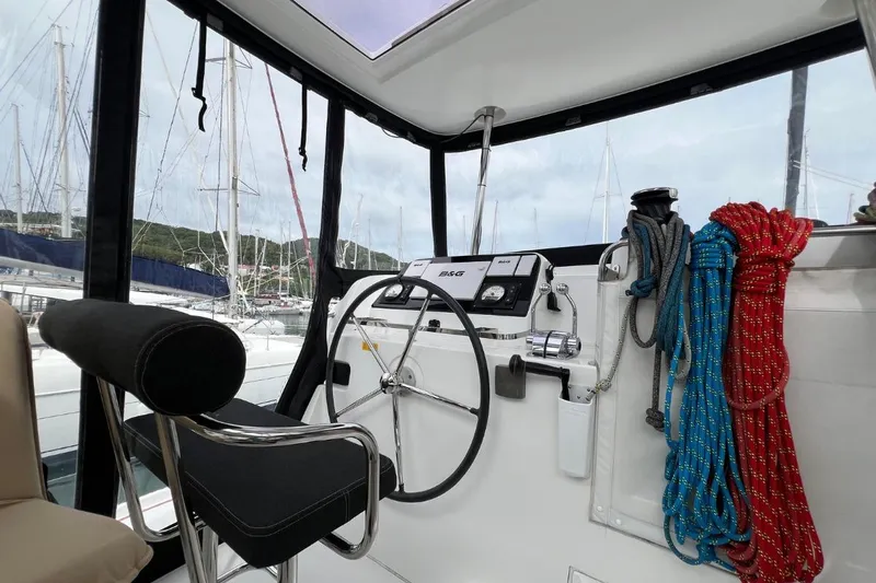 Mocean Yacht Photos Pics Helm of 2017 Lagoon 42 catamaran with ropes and navigation equipment.