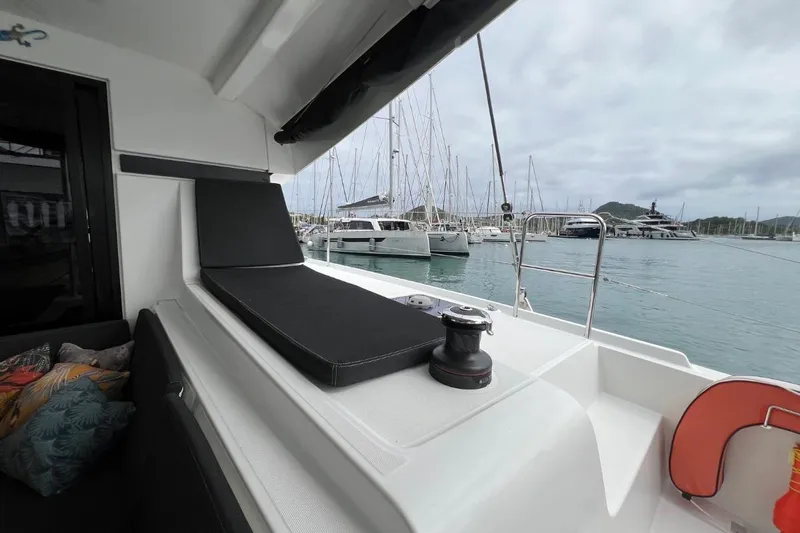 Mocean Yacht Photos Pics Lagoon 42 catamaran 2017 model, docked in marina with comfortable seating and scenic view.