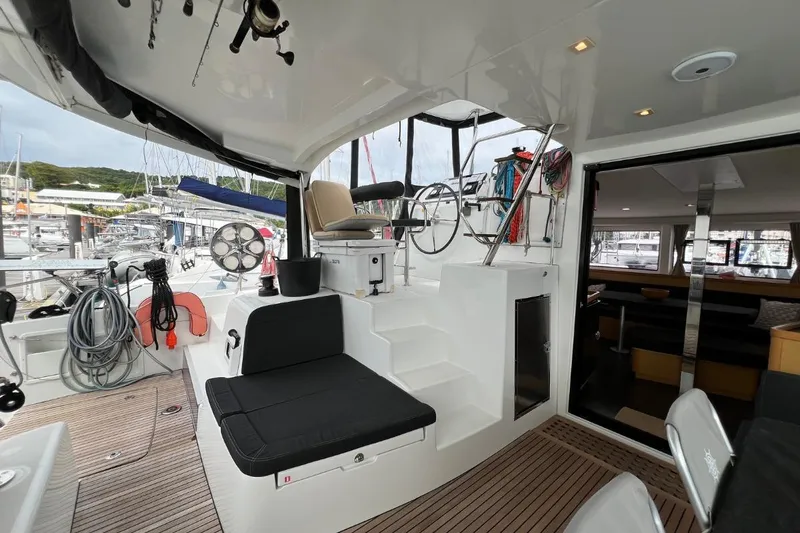 Mocean Yacht Photos Pics Interior view of 2017 Lagoon 42 catamaran, featuring helm station and seating area.