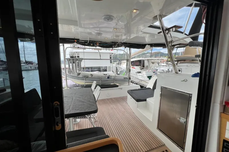 Mocean Yacht Photos Pics 2017 Lagoon 42 yacht interior with seating area and marina view.