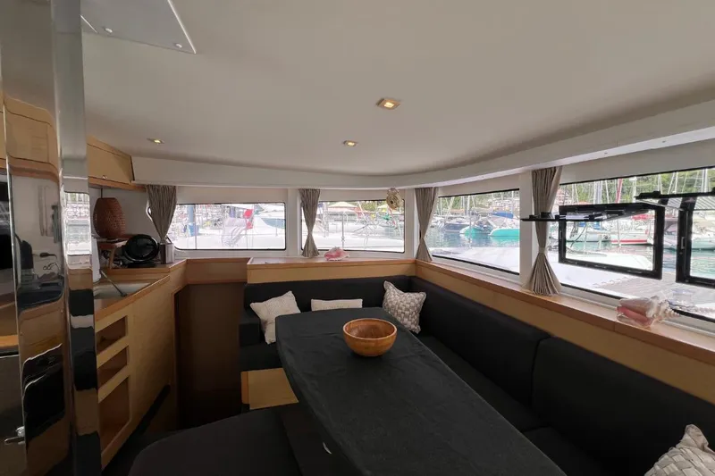 Mocean Yacht Photos Pics Interior of 2017 Lagoon 42 catamaran with spacious seating and panoramic windows.