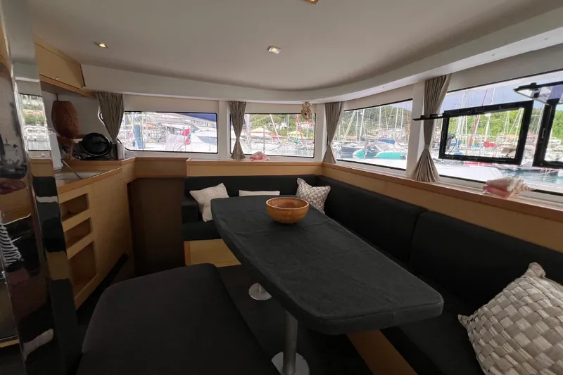 Mocean Yacht Photos Pics Interior of 2017 Lagoon 42 catamaran with cozy seating and large windows.