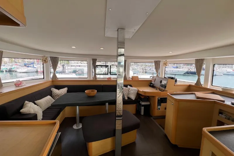 Mocean Yacht Photos Pics Interior of 2017 Lagoon 42 catamaran with spacious seating and panoramic windows.