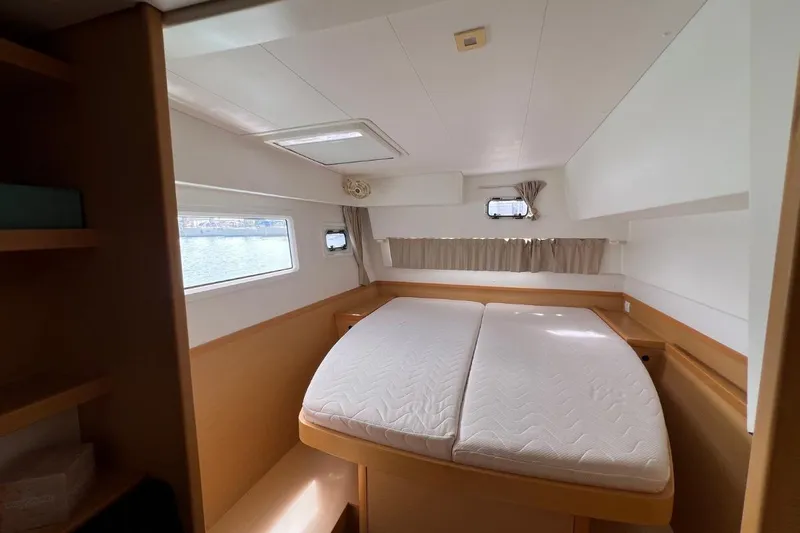 Mocean Yacht Photos Pics Interior cabin of 2017 Lagoon 42 catamaran with double bed and windows.