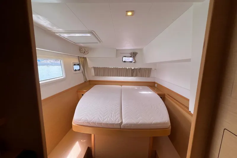Mocean Yacht Photos Pics Interior cabin of 2017 Lagoon 42 catamaran with double bed and windows.