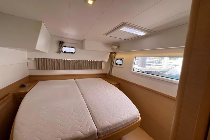 Mocean Yacht Photos Pics Interior cabin of 2017 Lagoon 42 catamaran with double bed and windows.