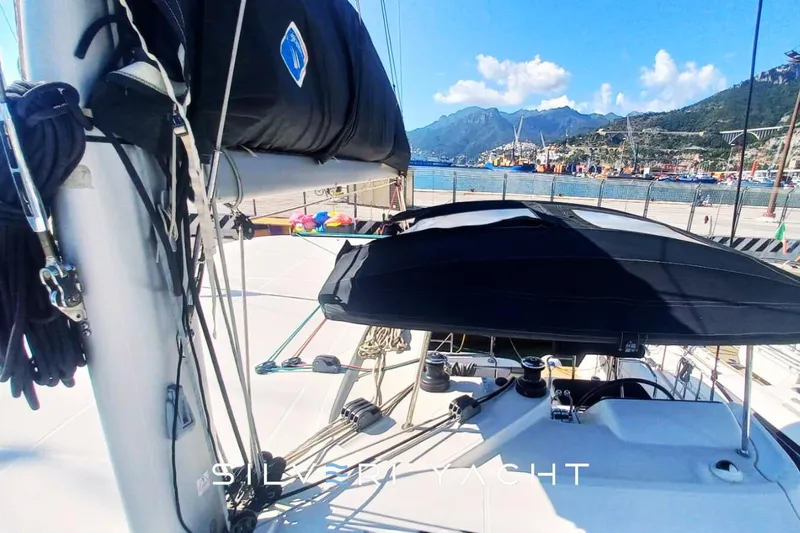  Yacht Photos Pics 2019 Lagoon 42 yacht deck with scenic coastal backdrop.