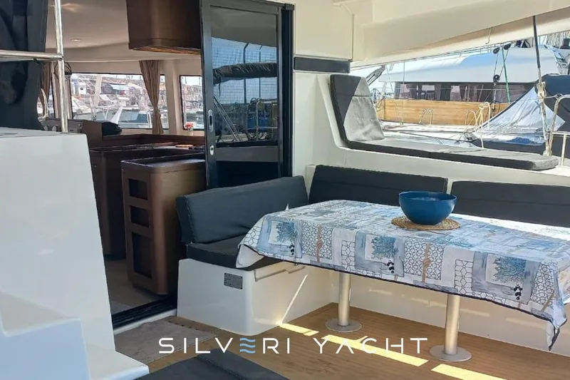  Yacht Photos Pics Interior of 2019 Lagoon 42 yacht with dining area and modern furnishings.